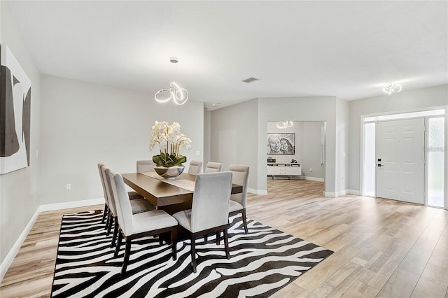 2912 51st St E, Bradenton, FL 34208 - dining space featuring light wood-type flooring and a chandelier