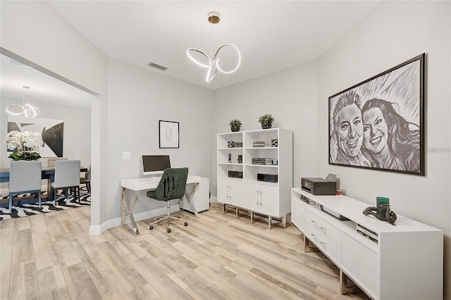 2912 51st St E, Bradenton, FL 34208 - home office with a chandelier and light wood-style flooring