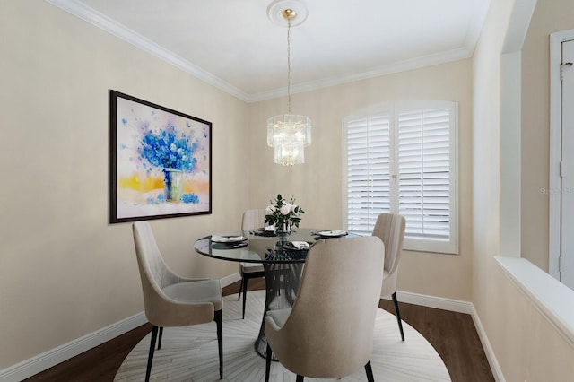 4998 Cedar Oak Way, Sarasota, FL 34233 - dining area with wood finished floors, a chandelier, and ornamental molding
