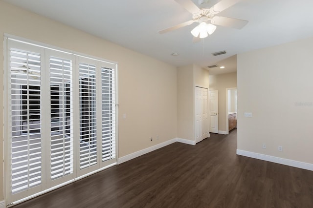 4998 Cedar Oak Way, Sarasota, FL 34233 - unfurnished room with dark wood finished floors, a ceiling fan, and recessed lighting