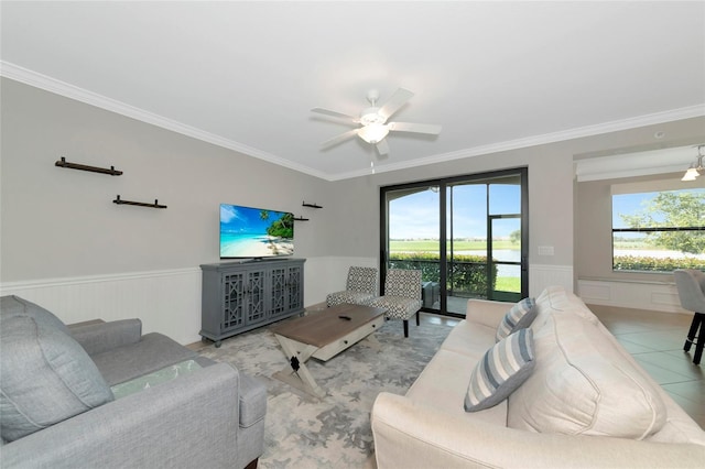 5604 Palmer Cir Unit 103, Bradenton, FL 34211 - living area featuring wainscoting, crown molding, and a ceiling fan