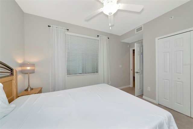 5604 Palmer Cir Unit 103, Bradenton, FL 34211 - bedroom featuring a closet, ceiling fan, and light colored carpet