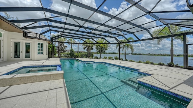 14665 Como Cir, Lakewood Ranch, FL 34202 - view of pool with french doors, a patio, a water view, and a pool with connected hot tub