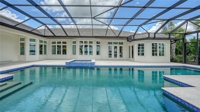 14665 Como Cir, Lakewood Ranch, FL 34202 - view of swimming pool featuring a patio area, a pool with connected hot tub, glass enclosure, and french doors