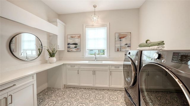 14665 Como Cir, Lakewood Ranch, FL 34202 - laundry room featuring washer and clothes dryer, healthy amount of natural light, and cabinet space