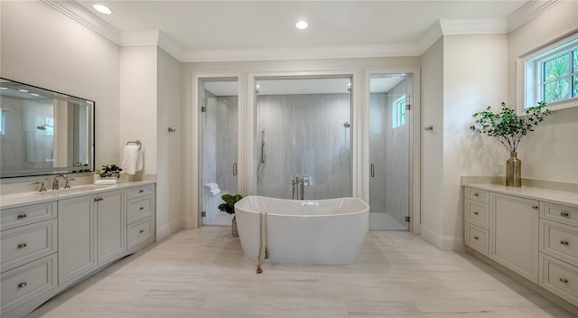 14665 Como Cir, Lakewood Ranch, FL 34202 - full bath with vanity, a freestanding tub, a stall shower, recessed lighting, and ornamental molding