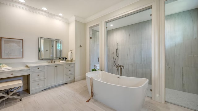 14665 Como Cir, Lakewood Ranch, FL 34202 - full bathroom with a freestanding tub, ornamental molding, vanity, a walk in shower, and recessed lighting
