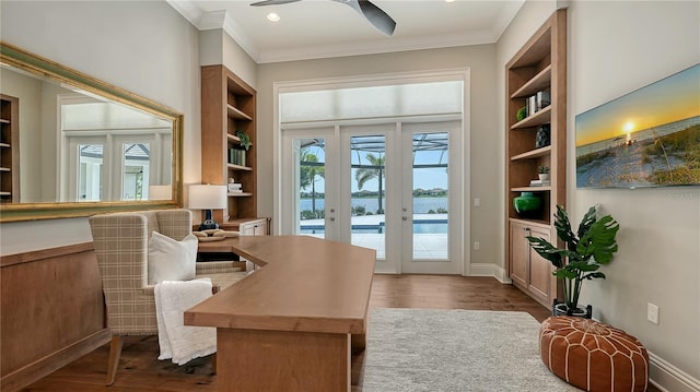 14665 Como Cir, Lakewood Ranch, FL 34202 - home office featuring crown molding, dark wood-style flooring, ceiling fan, built in features, and recessed lighting