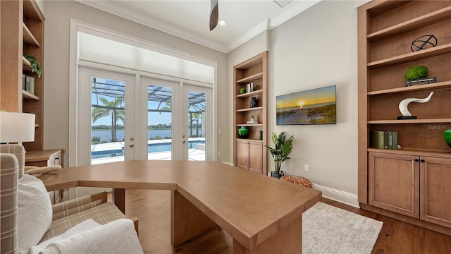 14665 Como Cir, Lakewood Ranch, FL 34202 - home office with crown molding, built in features, dark wood-style floors, and french doors