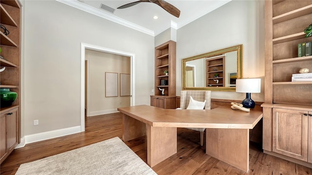 14665 Como Cir, Lakewood Ranch, FL 34202 - unfurnished office with crown molding, a ceiling fan, wood finished floors, built in shelves, and built in study area