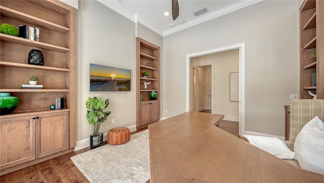 14665 Como Cir, Lakewood Ranch, FL 34202 - home office with built in shelves, crown molding, wood finished floors, and ceiling fan