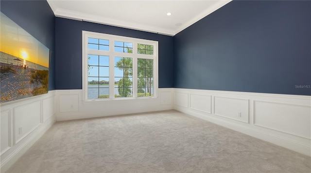 14665 Como Cir, Lakewood Ranch, FL 34202 - spare room featuring ornamental molding, carpet flooring, a wainscoted wall, a decorative wall, and a water view