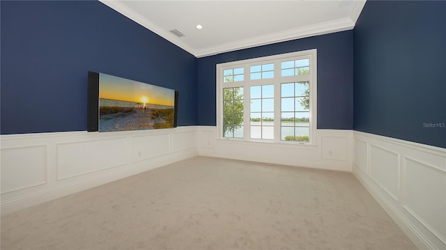 14665 Como Cir, Lakewood Ranch, FL 34202 - carpeted empty room featuring ornamental molding, a wainscoted wall, and a decorative wall