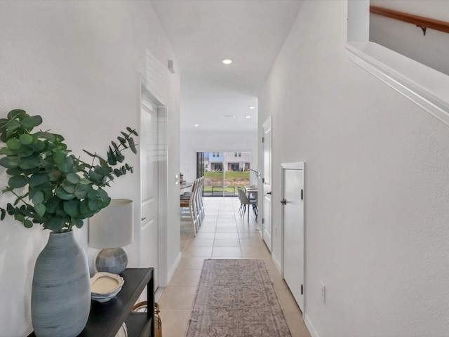 8733 Winter Breeze Way, Sarasota, FL 34241 - corridor featuring light tile patterned flooring and recessed lighting