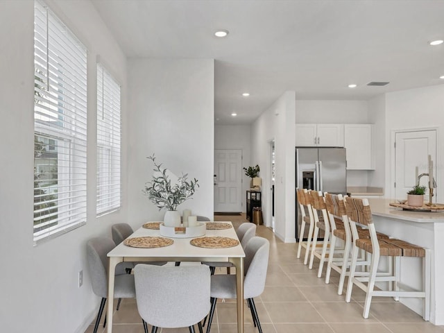 8733 Winter Breeze Way, Sarasota, FL 34241 - dining space with light tile patterned floors and recessed lighting