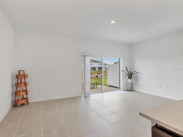 8733 Winter Breeze Way, Sarasota, FL 34241 - empty room featuring light tile patterned flooring, baseboards, and recessed lighting