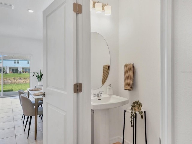 8733 Winter Breeze Way, Sarasota, FL 34241 - bathroom with tile patterned floors and a sink