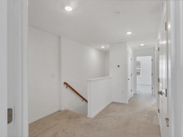 8733 Winter Breeze Way, Sarasota, FL 34241 - corridor featuring an upstairs landing, light carpet, baseboards, and recessed lighting