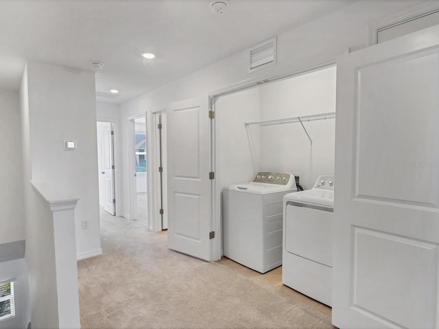 8733 Winter Breeze Way, Sarasota, FL 34241 - washroom with washing machine and dryer, light carpet, recessed lighting, and baseboards