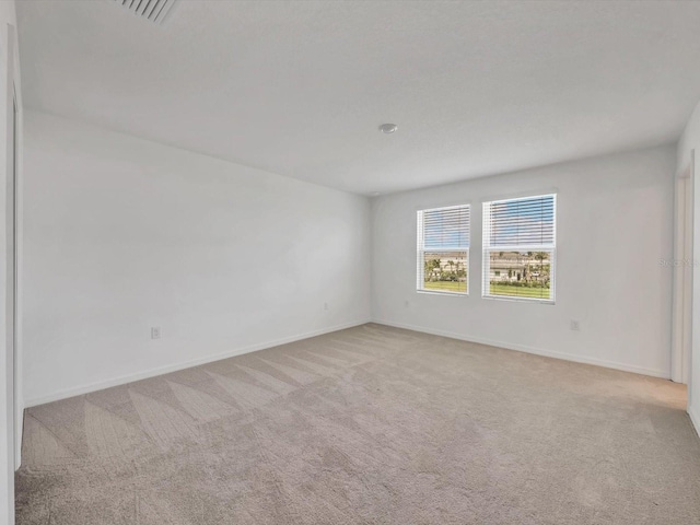 8733 Winter Breeze Way, Sarasota, FL 34241 - carpeted spare room featuring baseboards