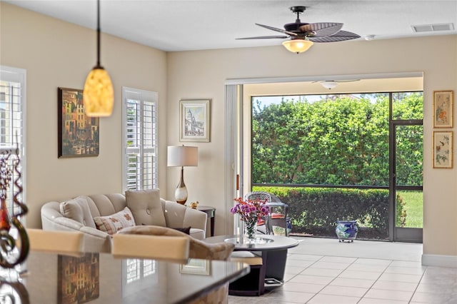 2070 Crystal Lake Trl, Bradenton, FL 34211 - tiled living area with plenty of natural light and a ceiling fan