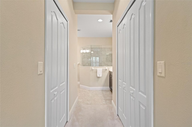 2070 Crystal Lake Trl, Bradenton, FL 34211 - hallway with light colored carpet and a textured wall