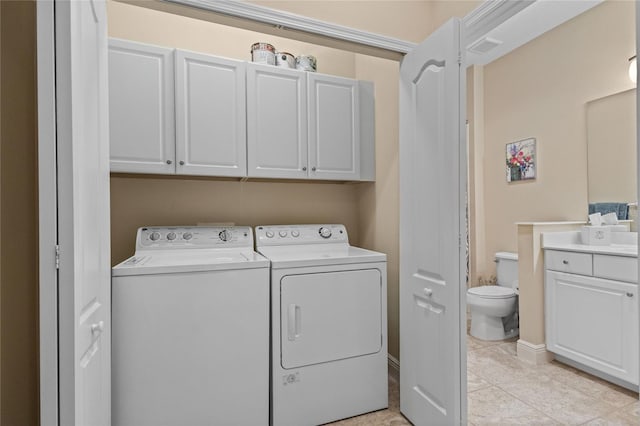 2070 Crystal Lake Trl, Bradenton, FL 34211 - washroom with cabinet space, washer and clothes dryer, and light tile patterned floors
