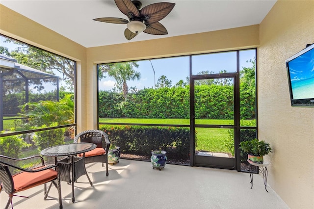 2070 Crystal Lake Trl, Bradenton, FL 34211 - sunroom featuring a ceiling fan and plenty of natural light
