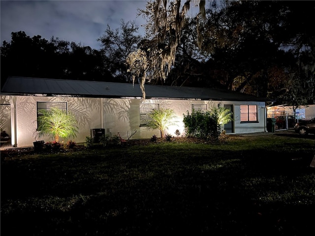 1840 3rd Ave E, Bradenton, FL 34208 - view of side of home featuring a yard and a metal roof
