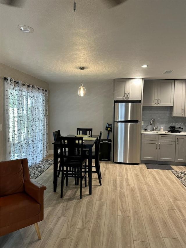 1840 3rd Ave E, Bradenton, FL 34208 - dining room featuring light wood-type flooring and recessed lighting