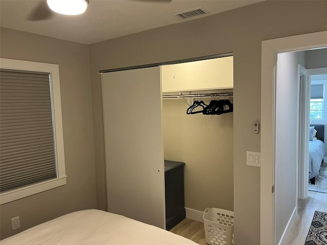 1840 3rd Ave E, Bradenton, FL 34208 - bedroom featuring light wood-style flooring, ceiling fan, and a closet