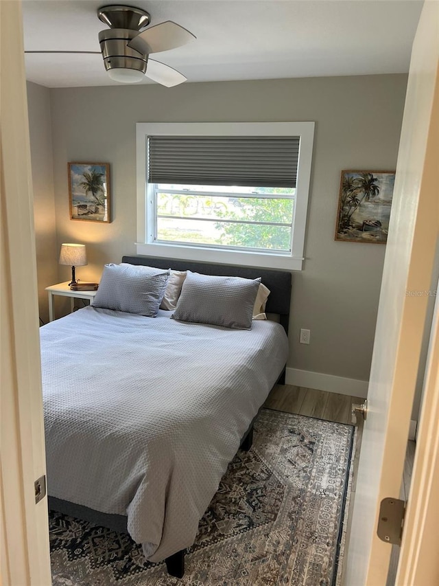1840 3rd Ave E, Bradenton, FL 34208 - bedroom featuring multiple windows, wood finished floors, and a ceiling fan