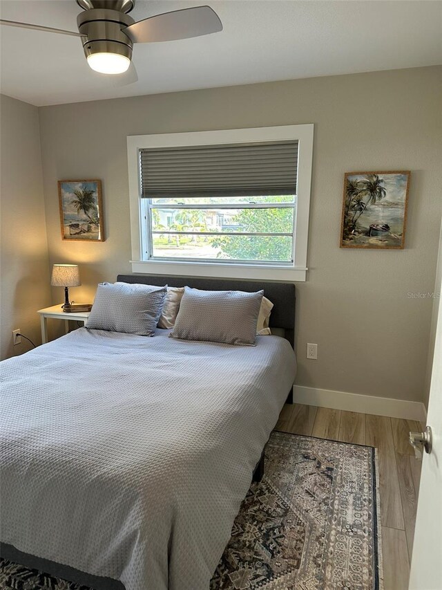 1840 3rd Ave E, Bradenton, FL 34208 - bedroom with multiple windows, wood finished floors, and a ceiling fan