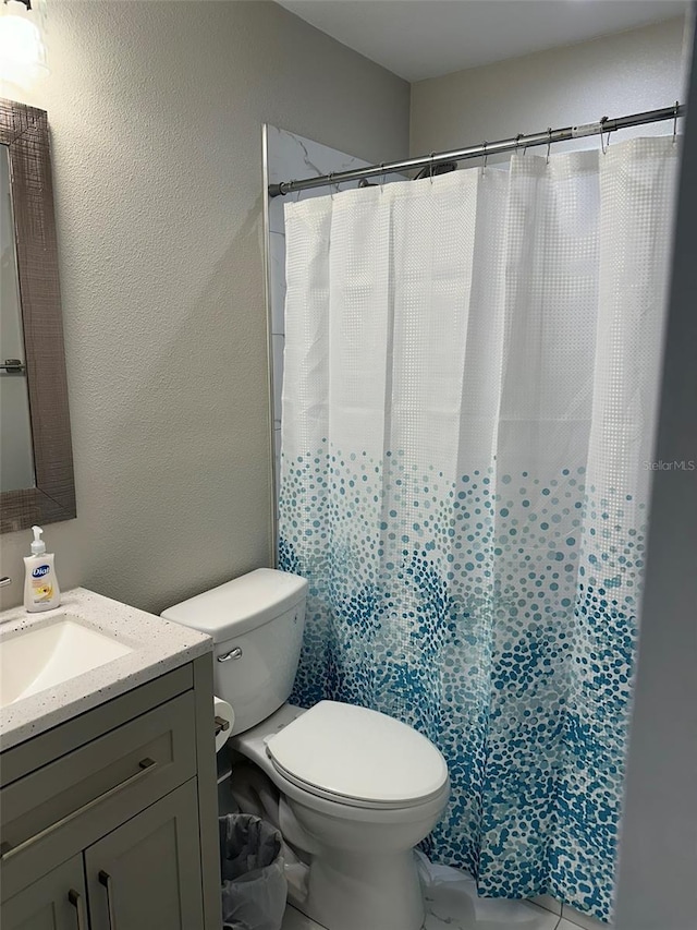 1840 3rd Ave E, Bradenton, FL 34208 - bathroom featuring vanity, a textured wall, and curtained shower