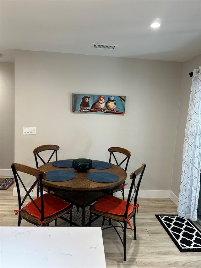 1840 3rd Ave E, Bradenton, FL 34208 - dining area featuring light wood-style flooring and recessed lighting