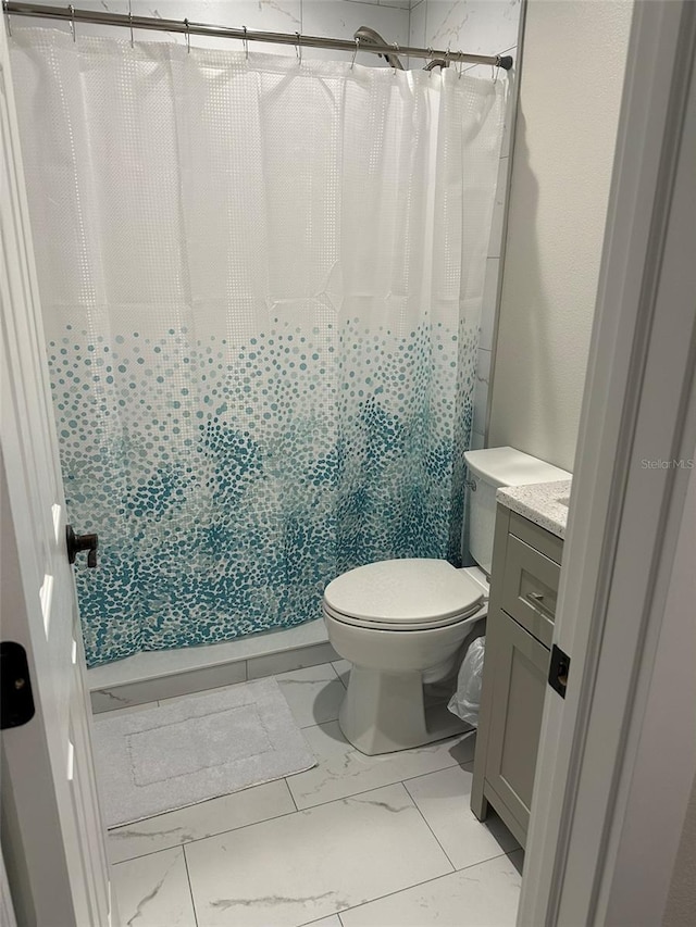 1840 3rd Ave E, Bradenton, FL 34208 - bathroom with marble look tile flooring, vanity, and curtained shower