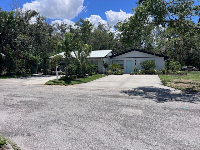 1840 3rd Ave E, Bradenton, FL 34208 - single story home with driveway and view of wooded area