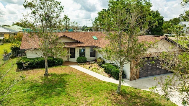 5213 20th Street Ct E, Bradenton, FL 34203 - view of front facade featuring an attached garage, a shingled roof, and concrete driveway
