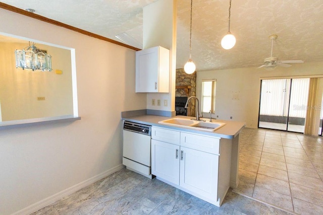 5213 20th Street Ct E, Bradenton, FL 34203 - kitchen featuring dishwasher, a peninsula, white cabinetry, pendant lighting, and a textured ceiling