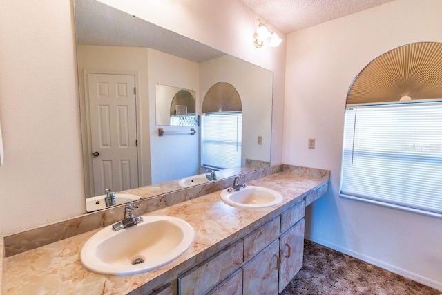 5213 20th Street Ct E, Bradenton, FL 34203 - bathroom featuring double vanity and a textured ceiling