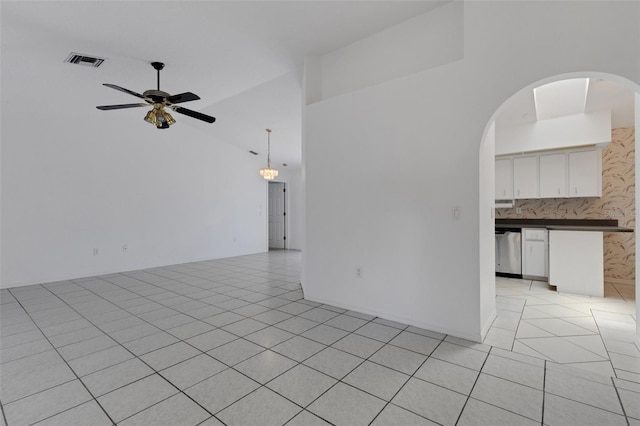 1026 Graham Rd, Venice, FL 34293 - spare room featuring ceiling fan, light tile patterned floors, arched walkways, and lofted ceiling