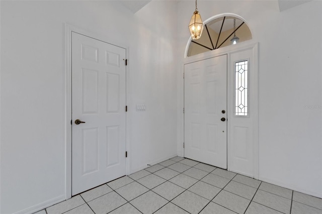 1026 Graham Rd, Venice, FL 34293 - entryway with light tile patterned floors and a chandelier