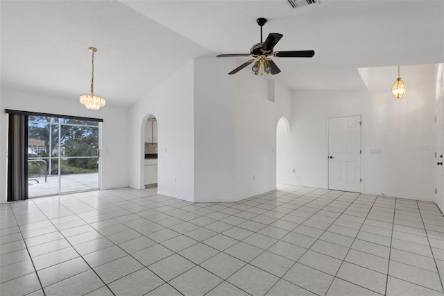 1026 Graham Rd, Venice, FL 34293 - spare room featuring arched walkways, a ceiling fan, high vaulted ceiling, a chandelier, and light tile patterned floors
