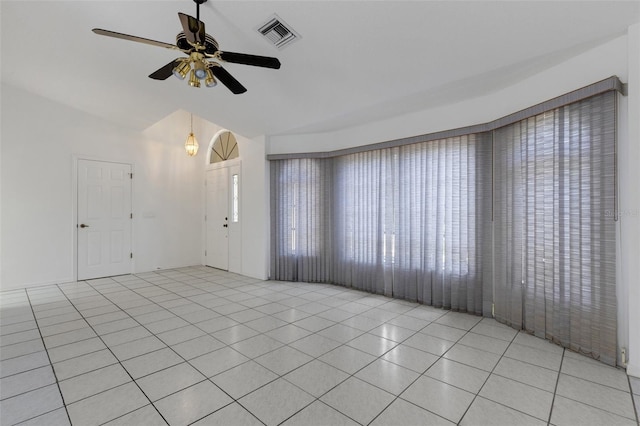 1026 Graham Rd, Venice, FL 34293 - empty room with ceiling fan, light tile patterned floors, and high vaulted ceiling