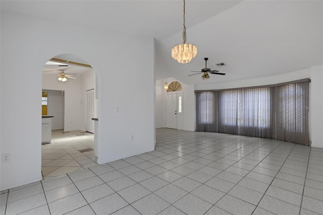 1026 Graham Rd, Venice, FL 34293 - spare room with ceiling fan, arched walkways, light tile patterned floors, a chandelier, and lofted ceiling