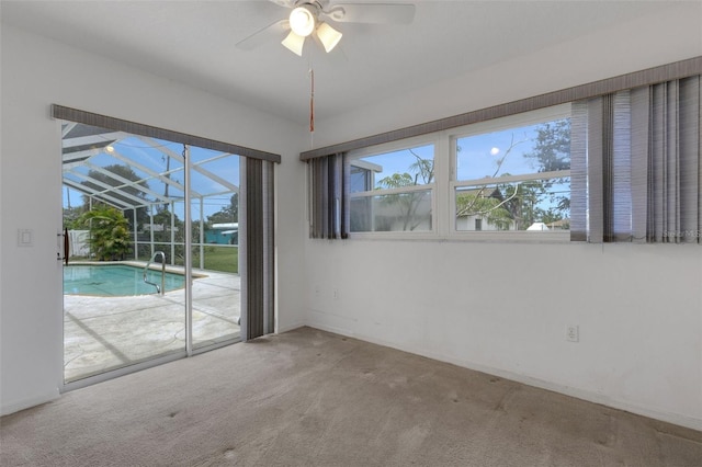 1026 Graham Rd, Venice, FL 34293 - carpeted empty room with a sunroom and ceiling fan