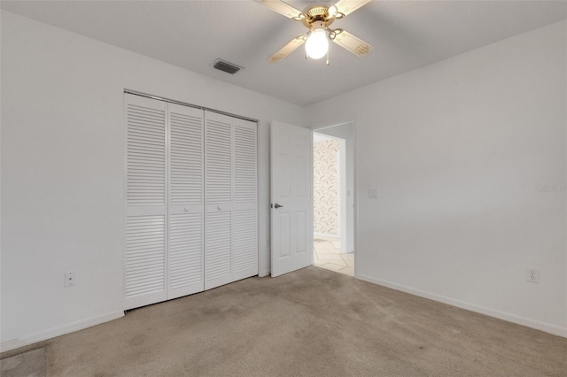 1026 Graham Rd, Venice, FL 34293 - unfurnished bedroom with carpet floors, a closet, and a ceiling fan