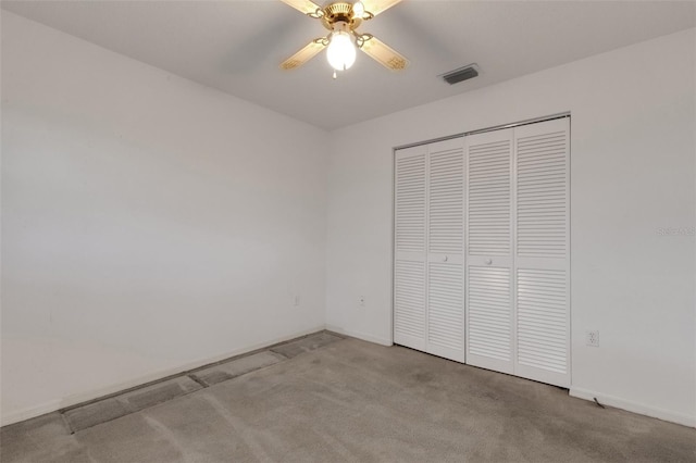 1026 Graham Rd, Venice, FL 34293 - unfurnished bedroom with carpet flooring, a closet, and a ceiling fan