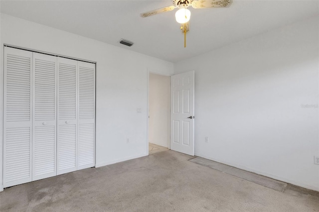 1026 Graham Rd, Venice, FL 34293 - unfurnished bedroom with carpet floors, a closet, and a ceiling fan
