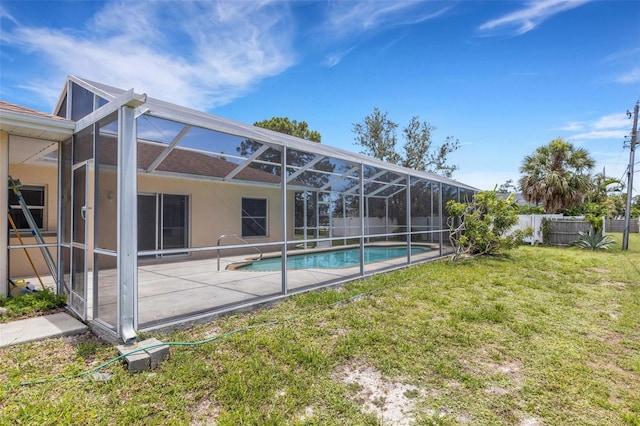 1026 Graham Rd, Venice, FL 34293 - rear view of property with a patio area, stucco siding, and glass enclosure